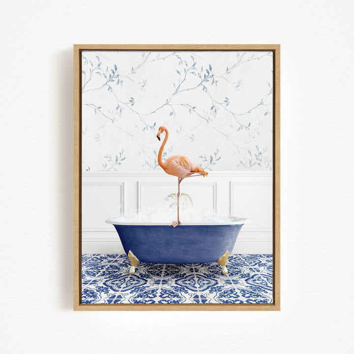 A pink flamingo standing on a blue bathtub filled with water, set against a white wall with a blue floral pattern.