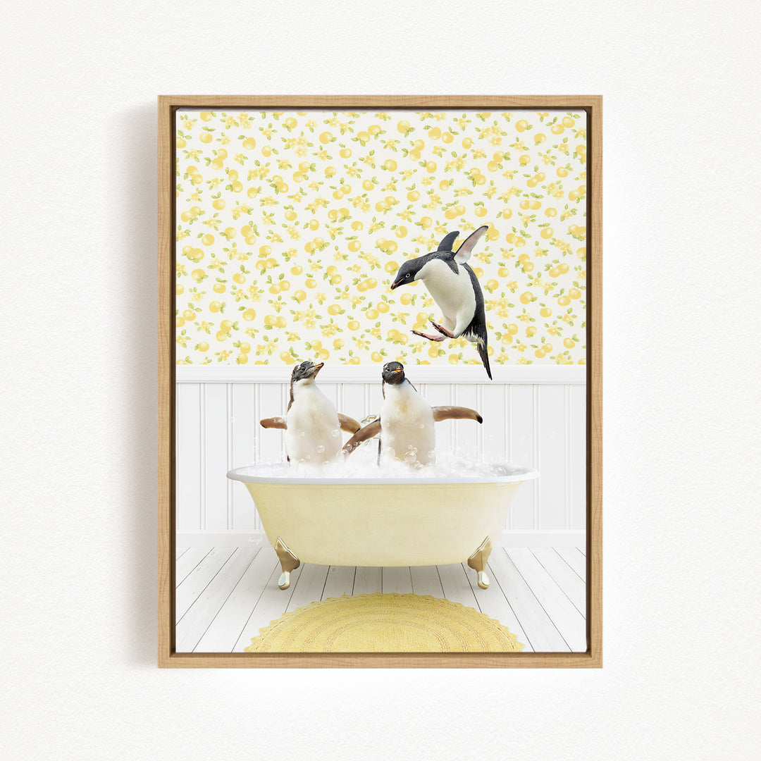 A framed image depicting three penguins sitting in a bathtub, with one penguin jumping out of the tub.