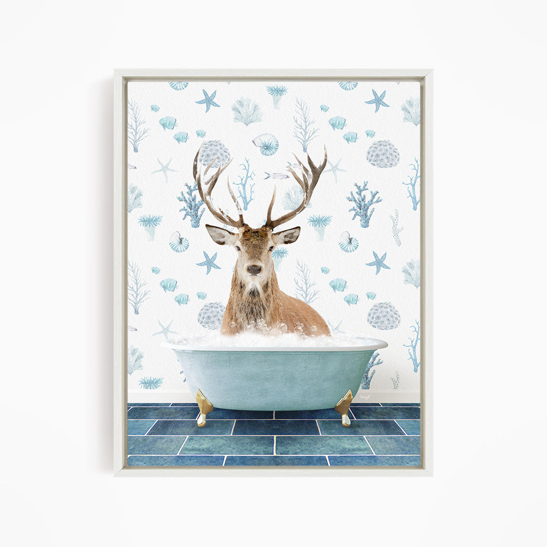 A deer with antlers is sitting in a bathtub filled with bubbles, surrounded by a pattern of blue and white seashells and starfish.