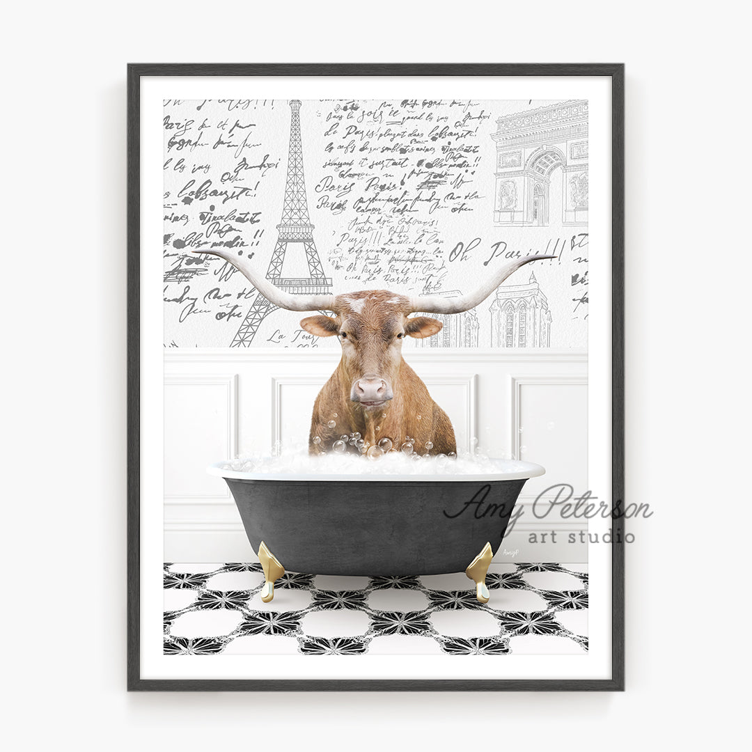 a cow is sitting in a bathtub with a long horn