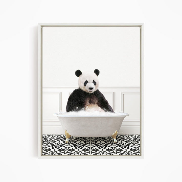 A panda bear sitting in a white bathtub filled with bubbles, surrounded by a black and white patterned floor.