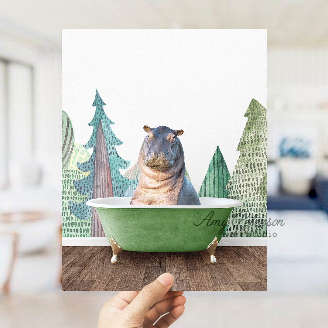 a hippo sitting in a green bathtub with trees in the background