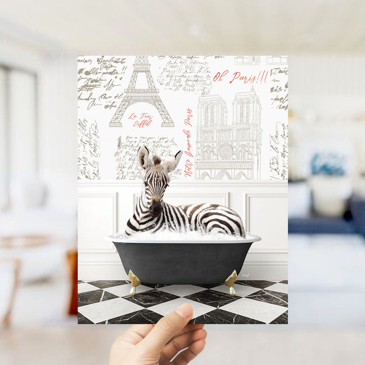 A zebra is sitting in a bathtub, surrounded by various Paris-themed elements such as the Eiffel Tower and the Notre-Dame Cathedral.