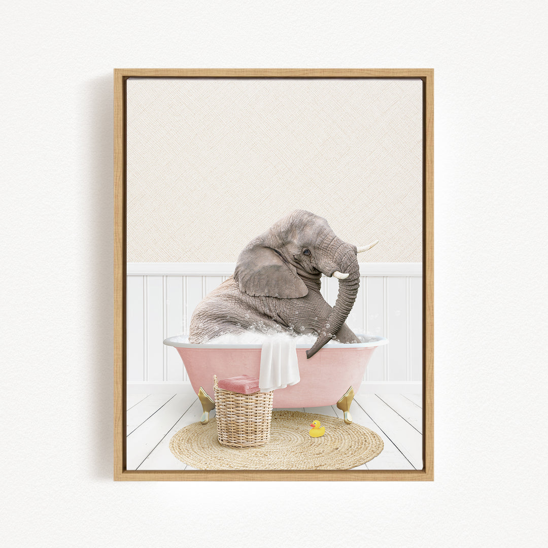 A gray elephant is sitting in a pink bathtub, surrounded by a basket of toys and a yellow rubber ducky, creating a whimsical and playful scene.