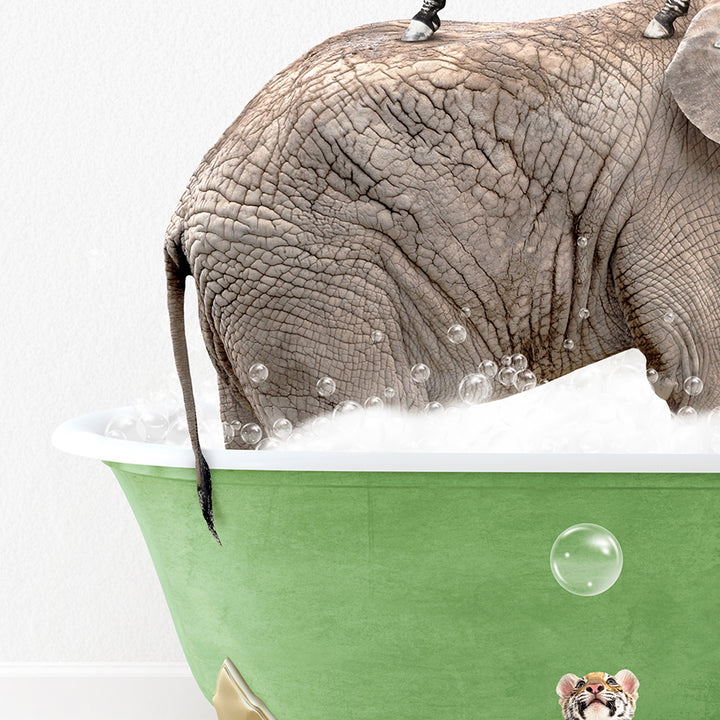 an elephant is taking a bath in a green bathtub