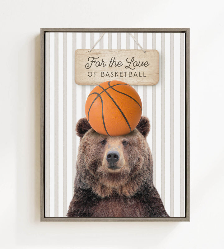 A framed image of a brown bear holding a basketball on its head, with a sign above that says "For the Love of Basketball".