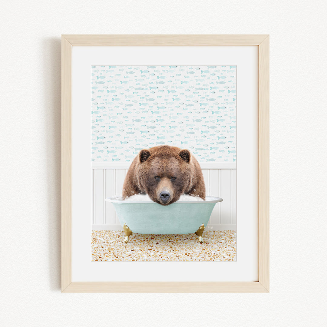 A brown bear is sitting in a light blue bathtub filled with bubbles, appearing to be enjoying a relaxing bath.