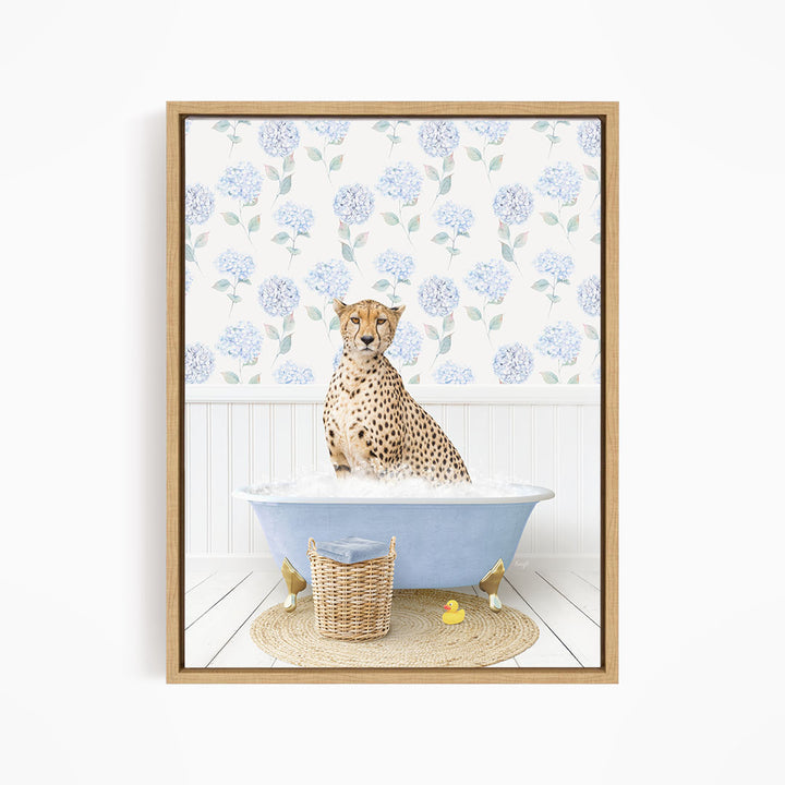 A cheetah sitting in a blue bathtub filled with water, surrounded by a wicker basket and rubber ducks.