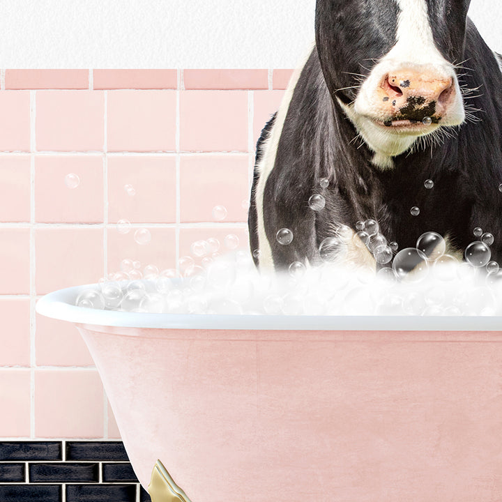 a black and white cow standing in a bathtub filled with bubbles