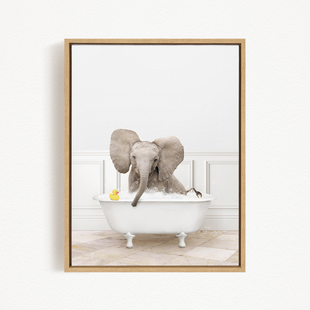 A baby elephant sitting in a white bathtub, surrounded by a yellow rubber duck.