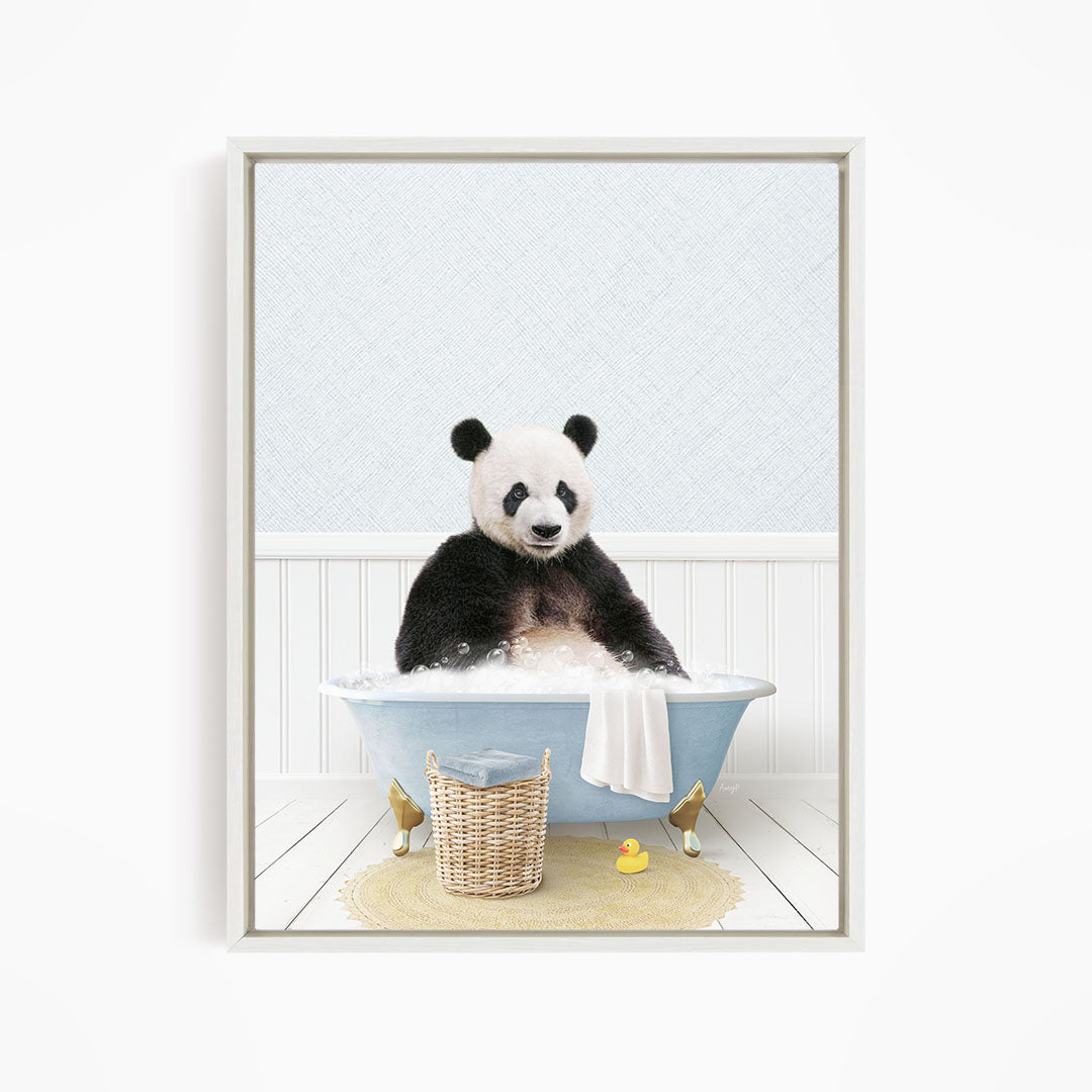 A panda bear sitting in a blue bathtub, surrounded by a yellow rubber duck and a basket.