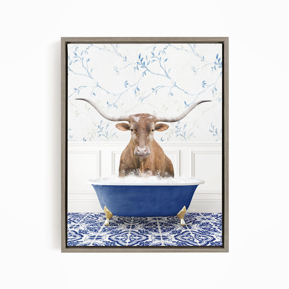 A brown cow with large white horns is sitting in a blue bathtub filled with water, surrounded by a blue and white patterned floor.