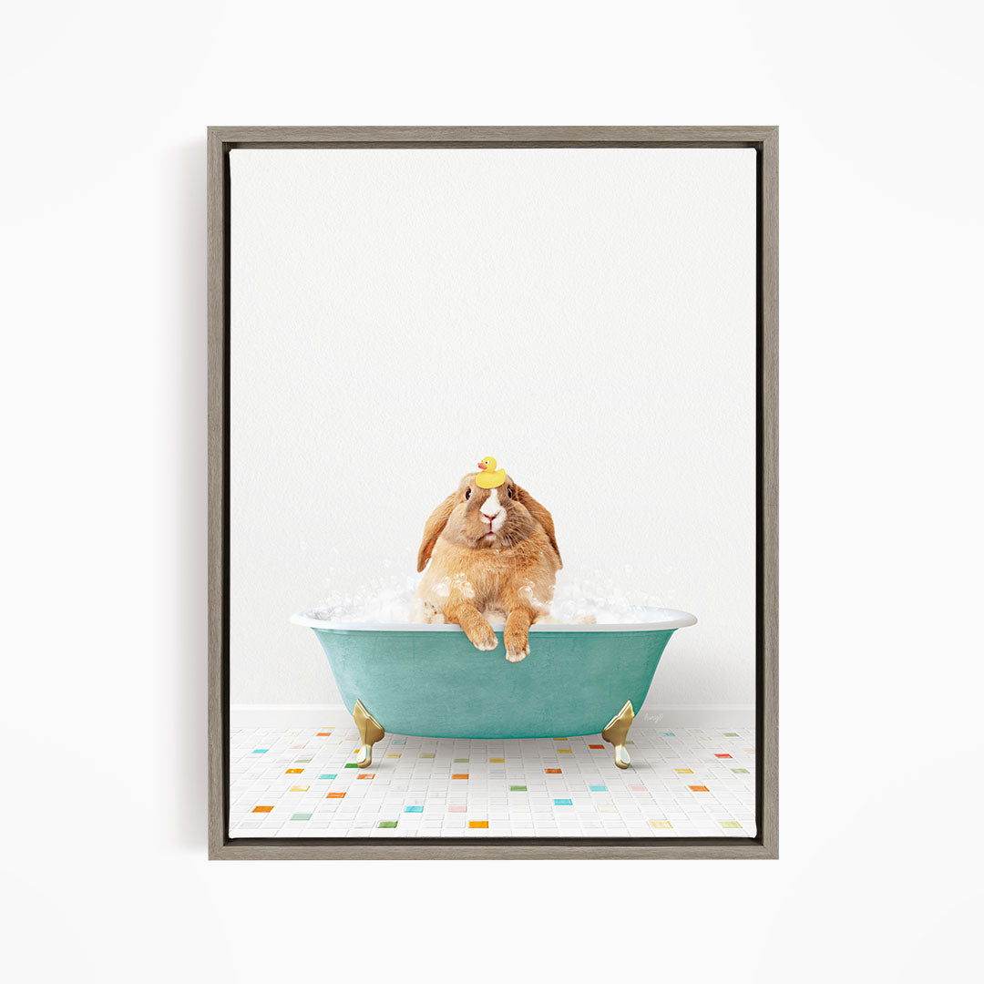 A brown rabbit sitting in a blue bathtub filled with bubbles, wearing a yellow hat.