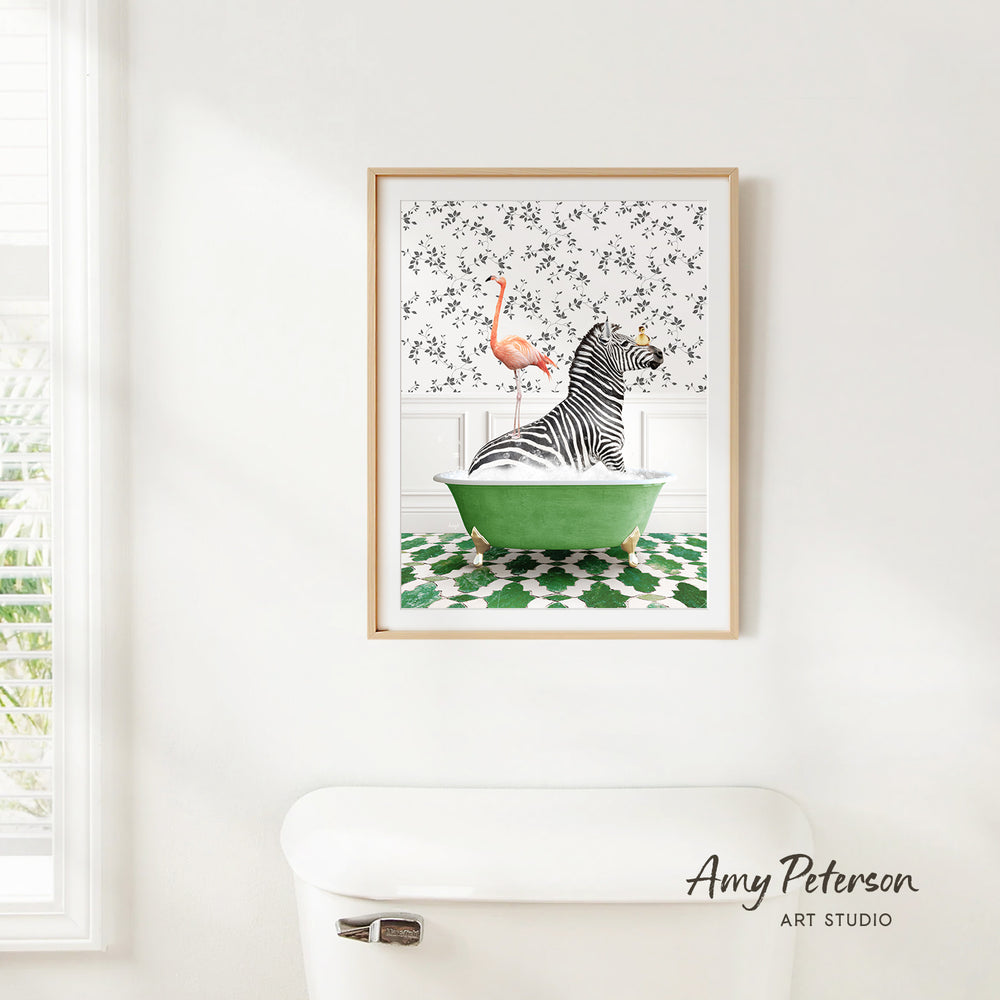 A framed print of a zebra sitting in a green bathtub, with a pink flamingo perched on the zebra's back.