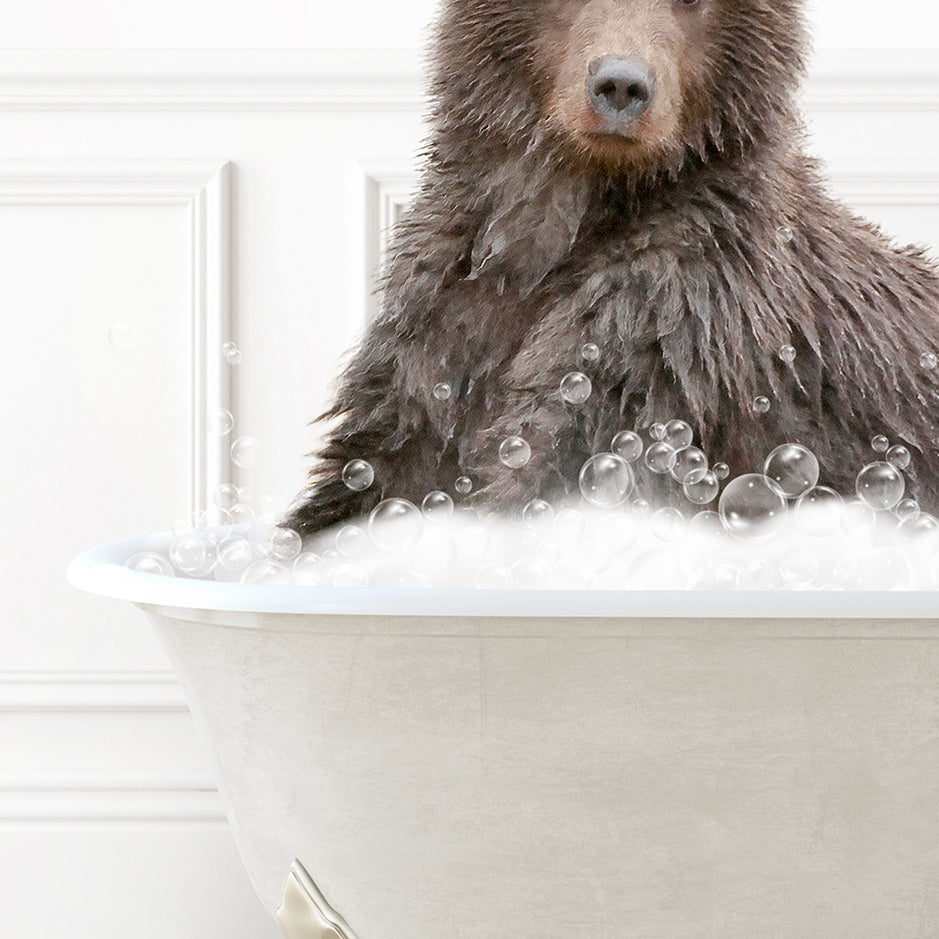 a brown bear sitting in a bathtub filled with bubbles