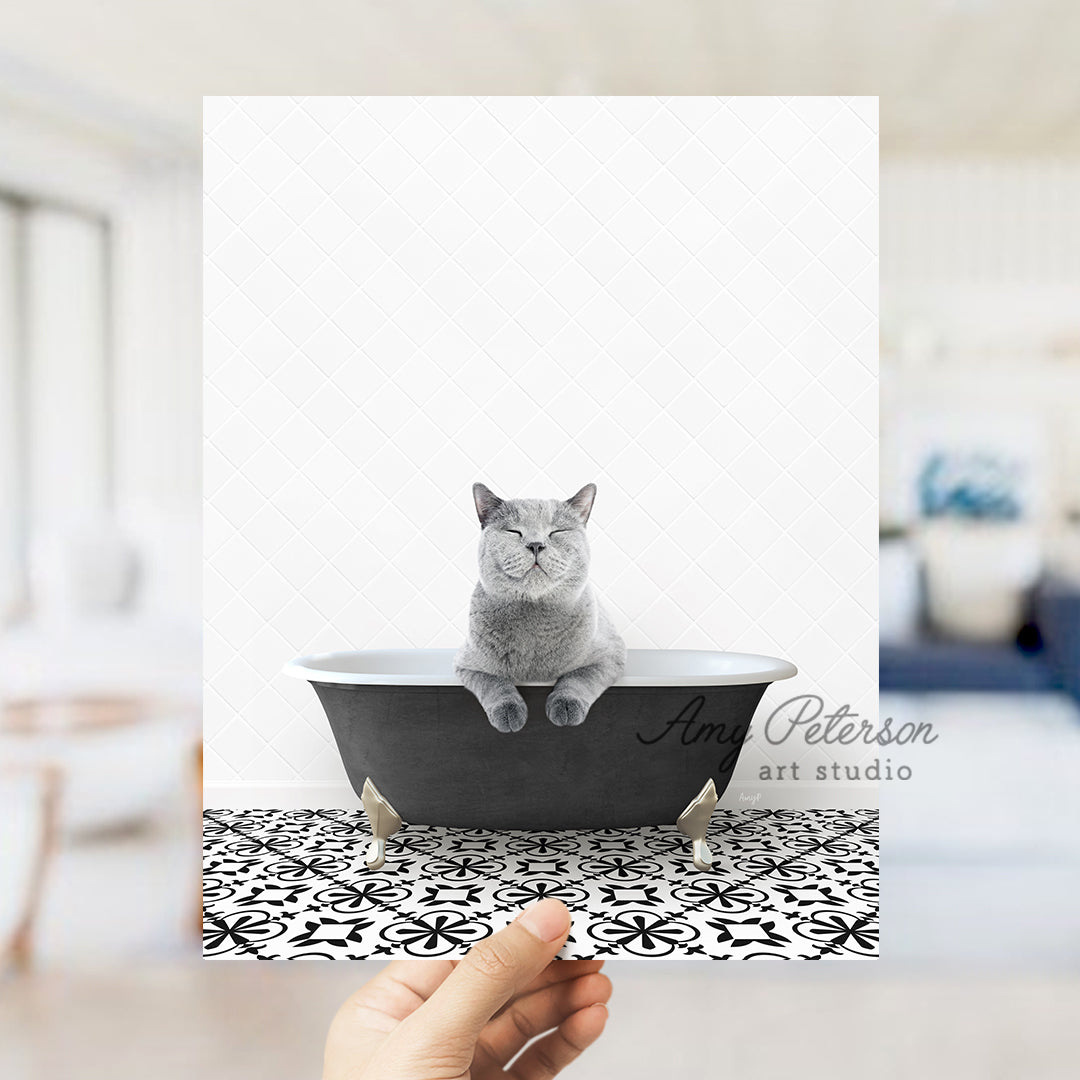 a person holding a card with a cat in a bathtub