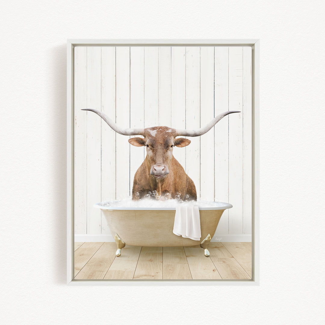 A brown bull with long horns is sitting in a white bathtub filled with water, creating a whimsical and humorous scene.