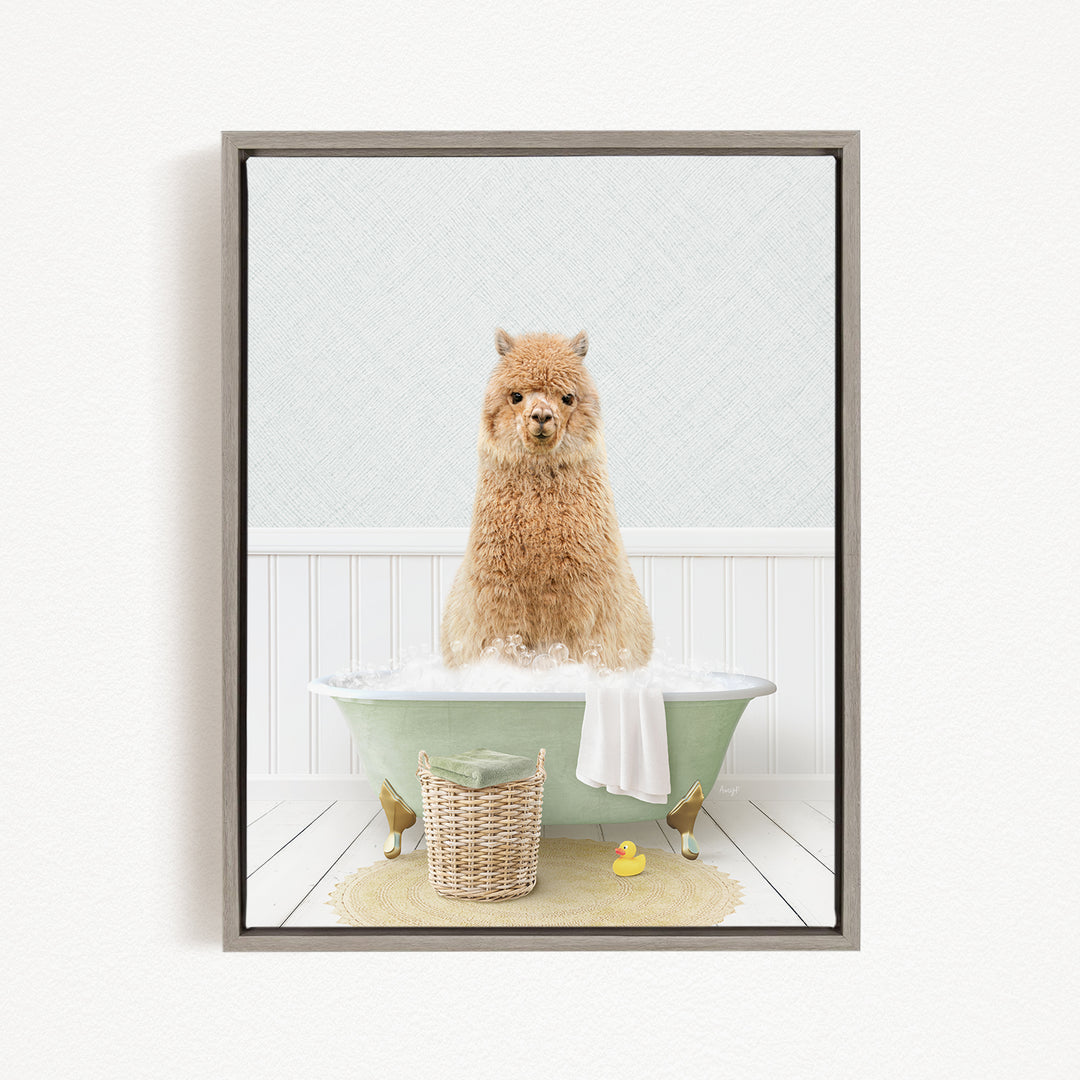 A fluffy brown alpaca sitting in a green bathtub filled with bubbles, surrounded by a basket of toys and a yellow rubber duck.