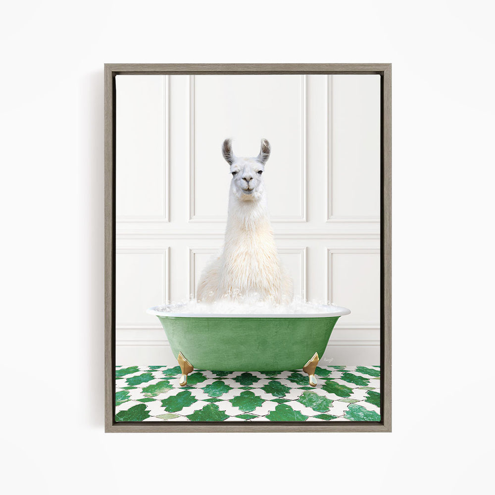 A white llama sitting in a green bathtub filled with bubbles, with a patterned green and white floor in the background.