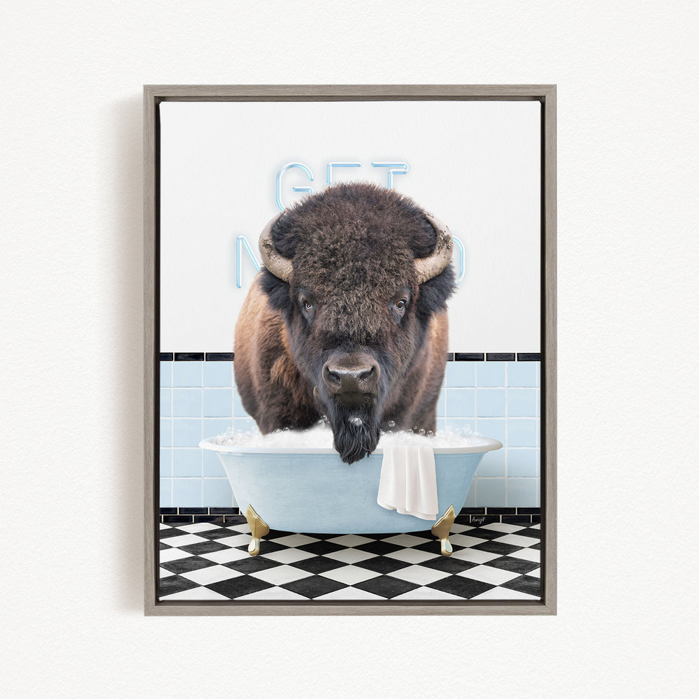 A buffalo is sitting in a bathtub filled with water, with a towel draped over the side of the tub.