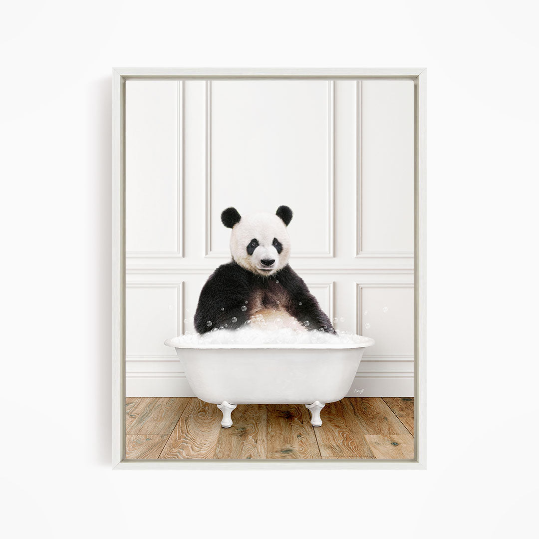 A panda bear sitting in a white bathtub filled with bubbles, creating a whimsical and playful scene.