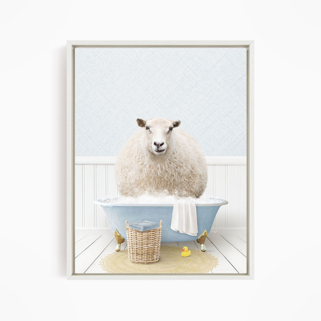 A fluffy white sheep sits in a blue bathtub filled with bubbles, surrounded by a yellow rubber duck and a wicker basket.