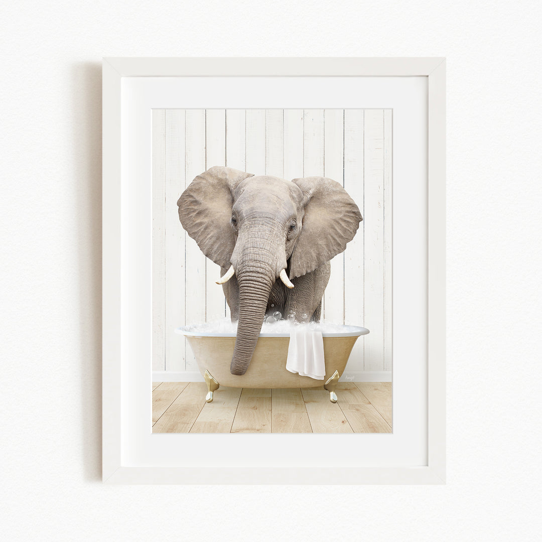 A large gray elephant is sitting in a white bathtub filled with water, with its trunk extended towards the water.