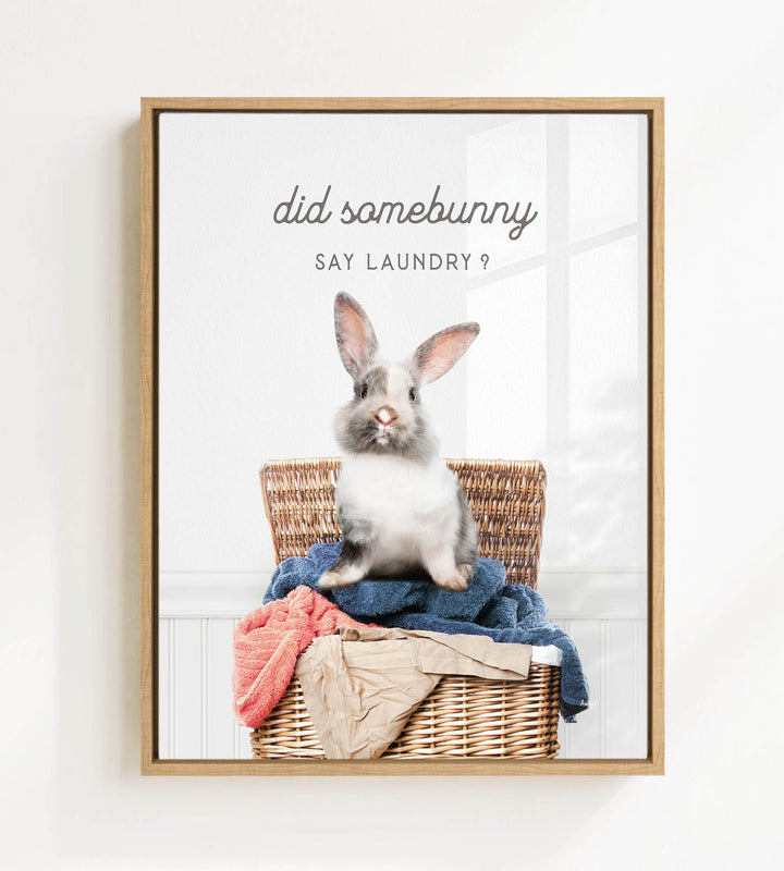 A cute rabbit sitting in a wicker basket filled with clothes, with the text "Did some bunny Say laundry?" displayed above the image.