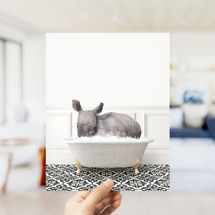 A rhinoceros sitting in a bathtub filled with bubbles, creating a whimsical and playful scene.