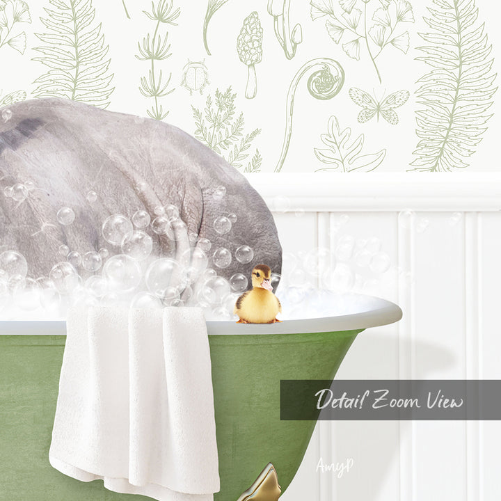 A small yellow duck sitting in a green bathtub filled with bubbles, with a towel draped over the side and a plant-themed wallpaper in the background.
