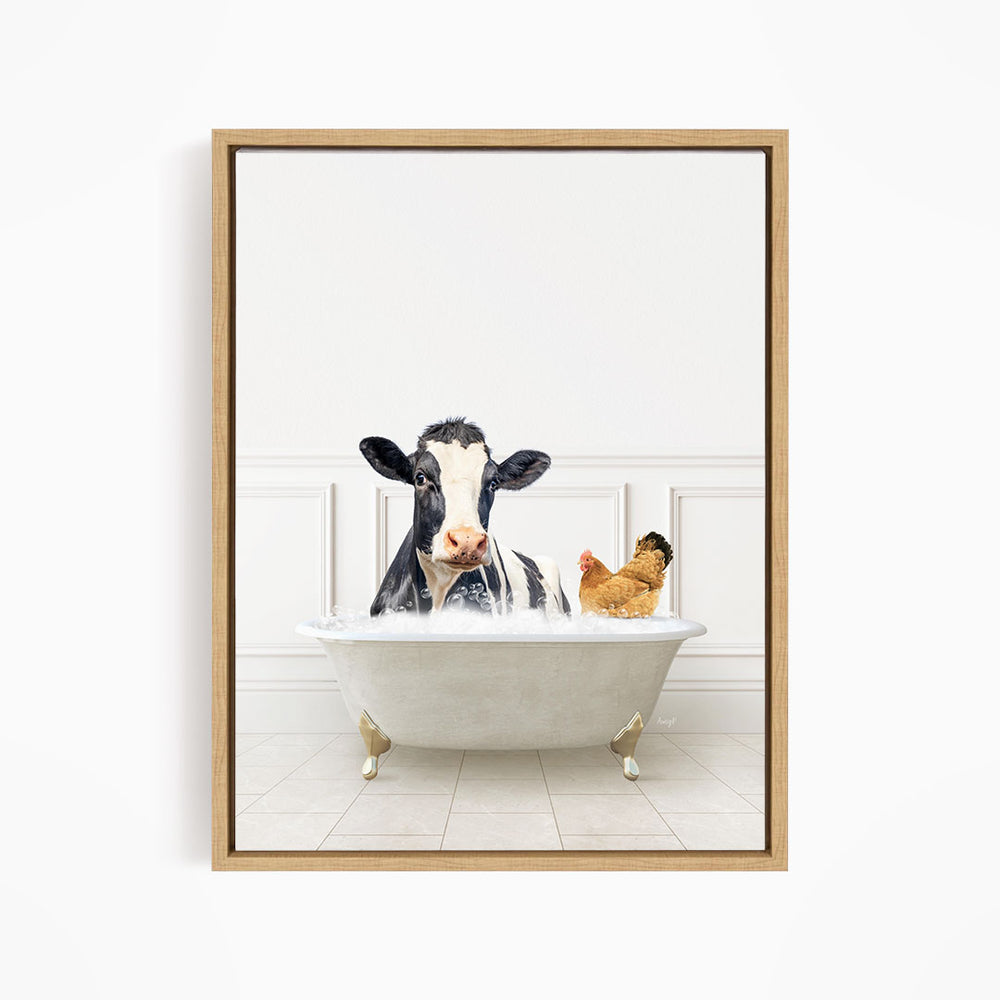 A black and white cow is sitting in a white bathtub, with a chicken standing nearby, in a white-walled room.