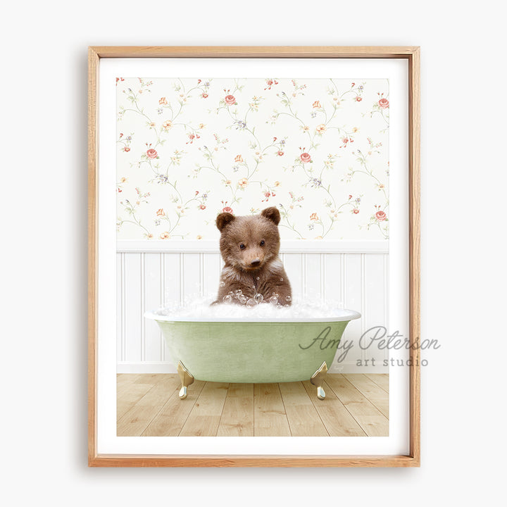 a brown teddy bear sitting in a green bath tub