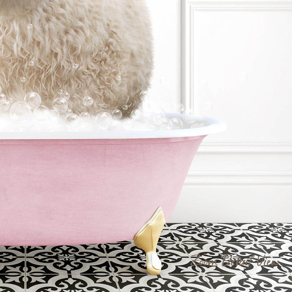 A fluffy white dog is sitting in a pink bathtub filled with bubbles, with a gold-colored bathtub leg visible.