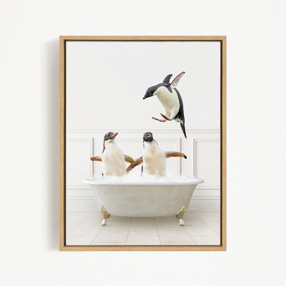 A framed image depicting three penguins in a bathtub, with one penguin flying above the tub.