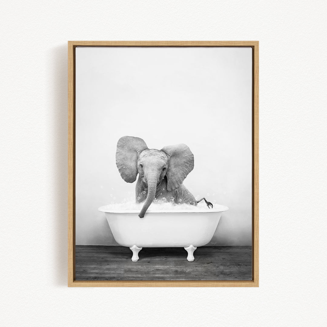 A baby elephant sitting in a white bathtub filled with water, creating a whimsical and playful scene.