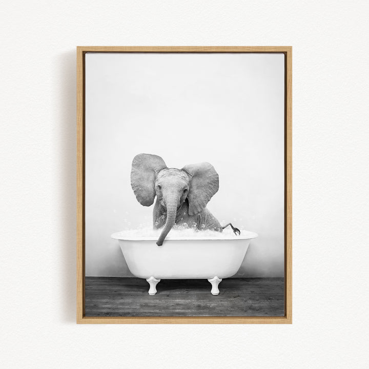 A baby elephant sitting in a white bathtub filled with water, creating a whimsical and playful scene.