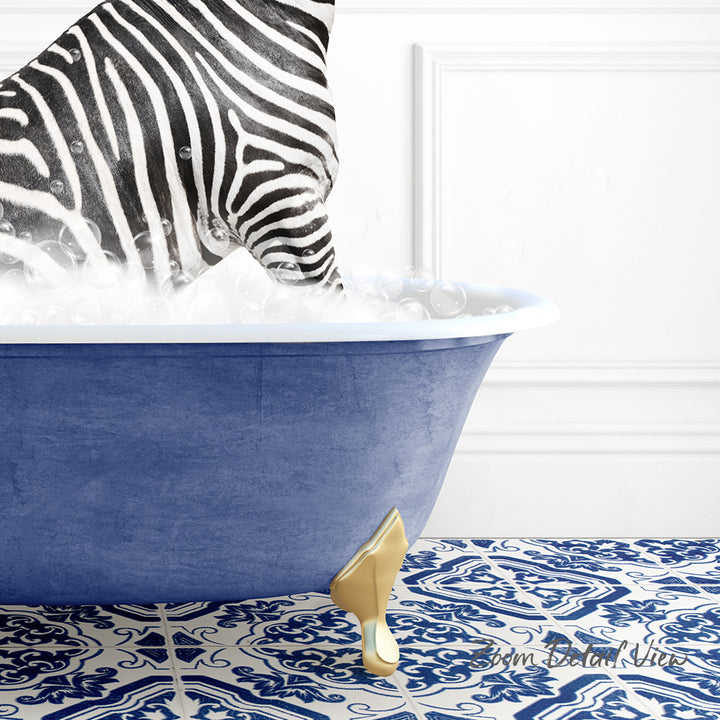 A zebra standing in a blue bathtub filled with bubbles, with a gold-colored bathtub faucet and a patterned blue and white floor in the background.