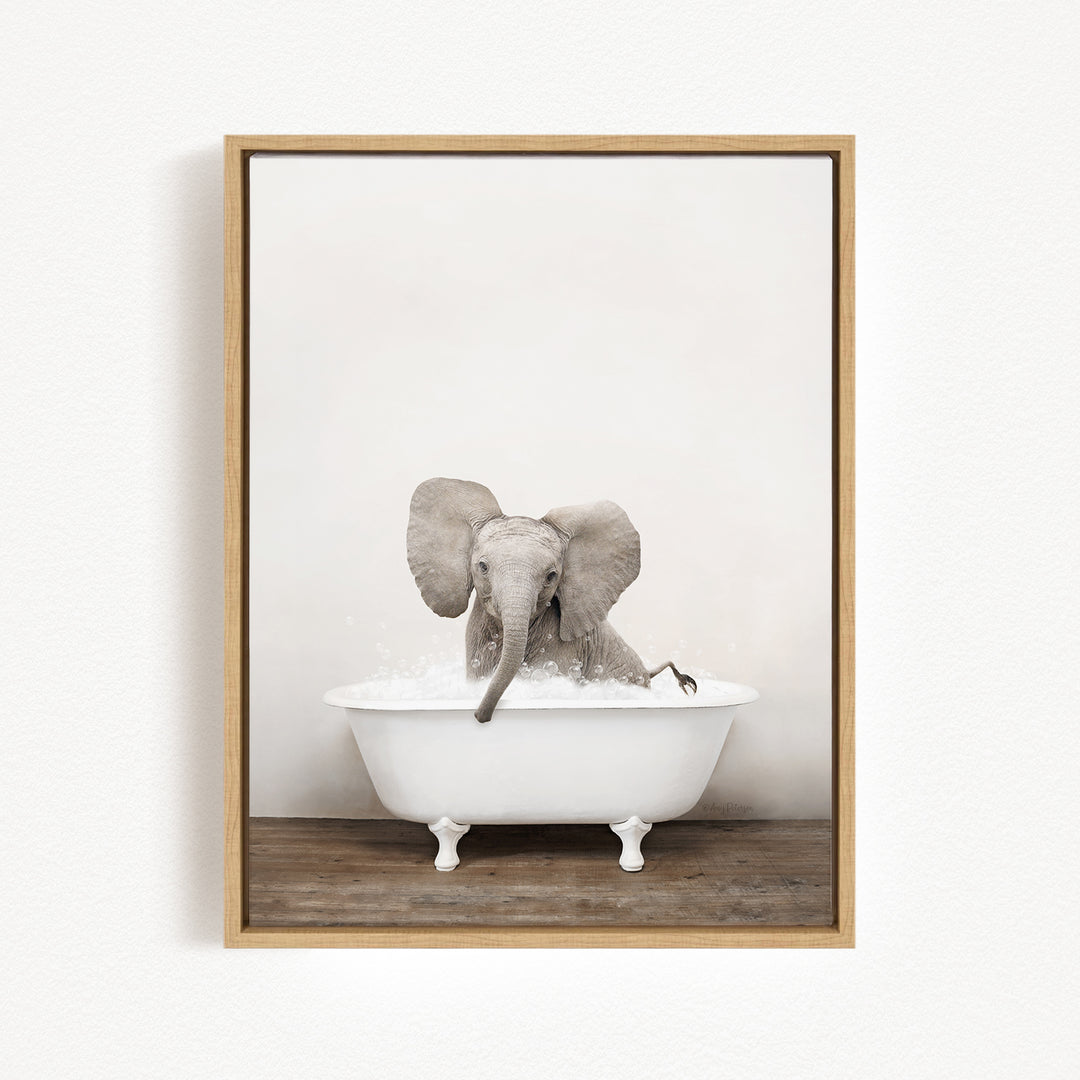 A baby elephant sitting in a white bathtub filled with water, creating a playful and whimsical scene.