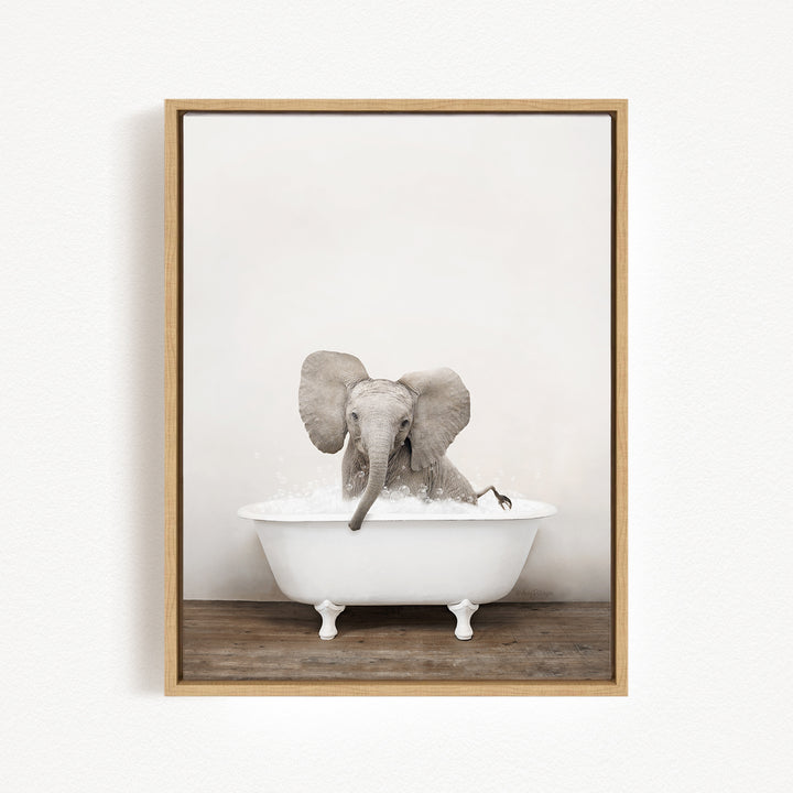 A baby elephant sitting in a white bathtub filled with water, creating a playful and whimsical scene.