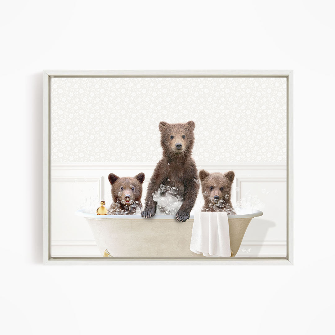 Three adorable brown bears enjoying a relaxing bath in a white bathtub.