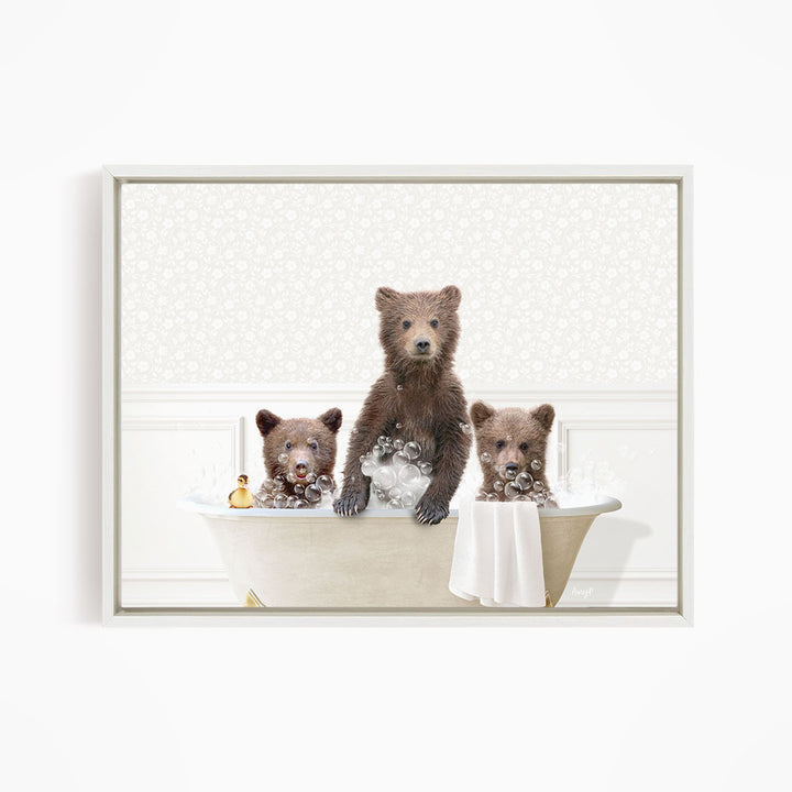 Three adorable brown bears enjoying a relaxing bath in a white bathtub.
