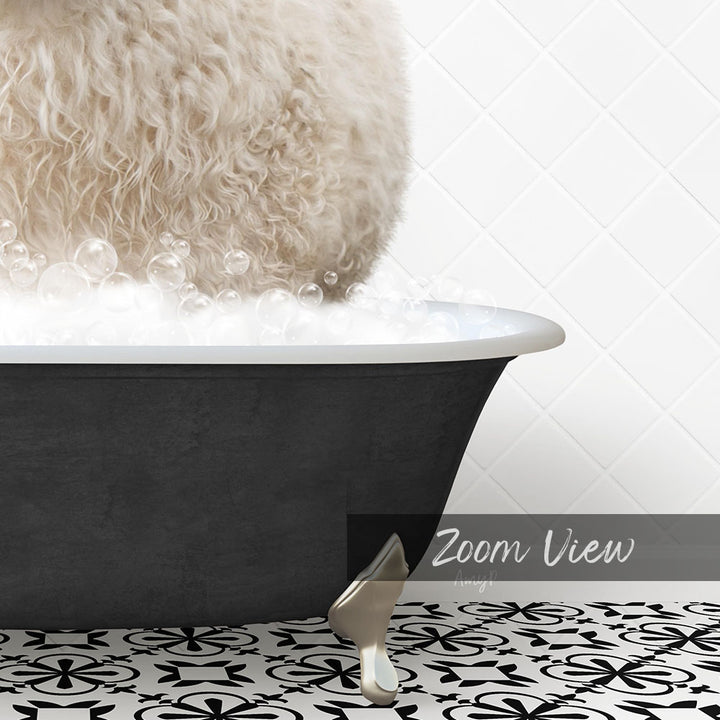 A fluffy white dog is sitting in a bathtub filled with bubbles, with a black and white patterned floor in the foreground.