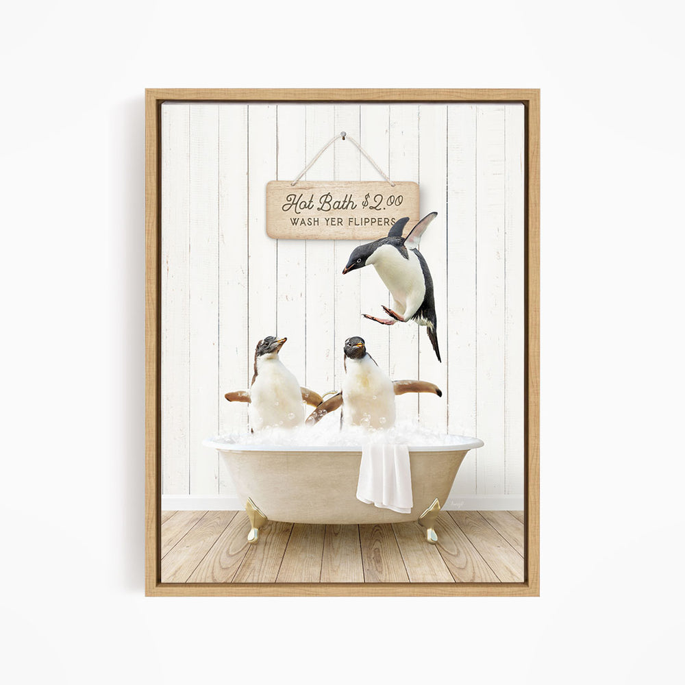 A framed image depicting three penguins sitting in a bathtub, with a sign above them that reads "Hot Bath $2.00 WASH YER FLIPERS".