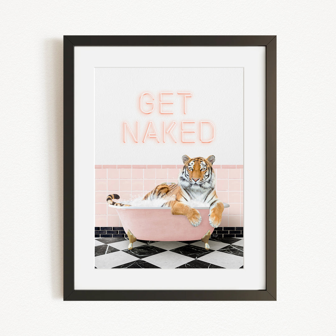 A framed print featuring a tiger sitting in a pink bathtub with the text "GET NAKED" displayed above it.