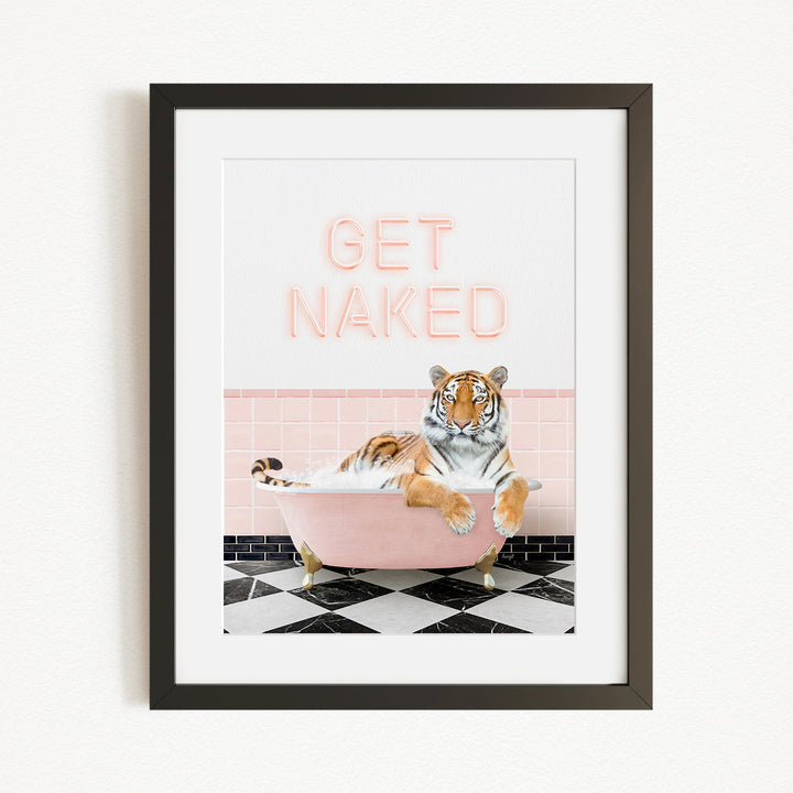 A framed print featuring a tiger sitting in a pink bathtub with the text "GET NAKED" displayed above it.