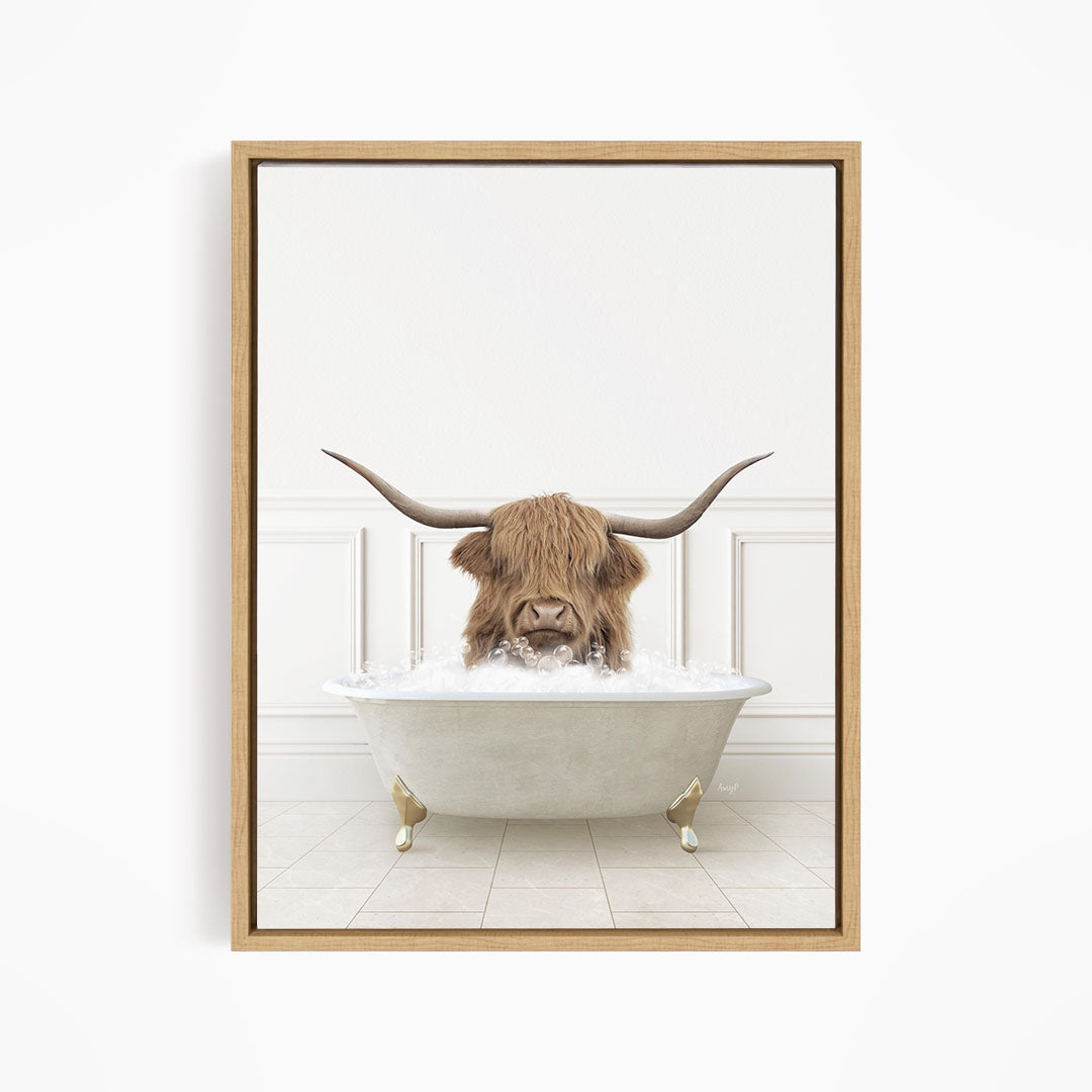 A brown cow with long horns is sitting in a white bathtub filled with water, creating a whimsical and humorous scene.