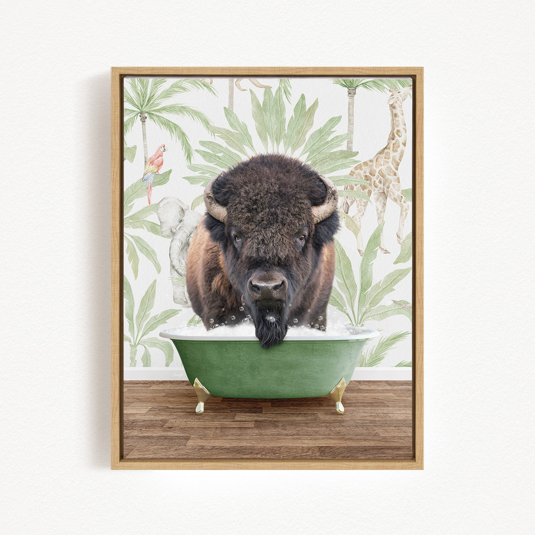 A buffalo is sitting in a green bathtub, surrounded by tropical foliage and a giraffe in the background.