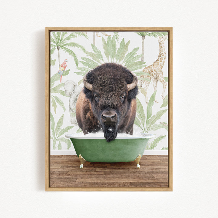 A buffalo is sitting in a green bathtub, surrounded by tropical foliage and a giraffe in the background.