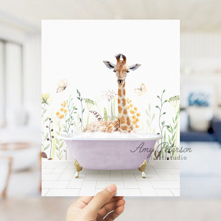 a giraffe standing in a bathtub with flowers on the wall