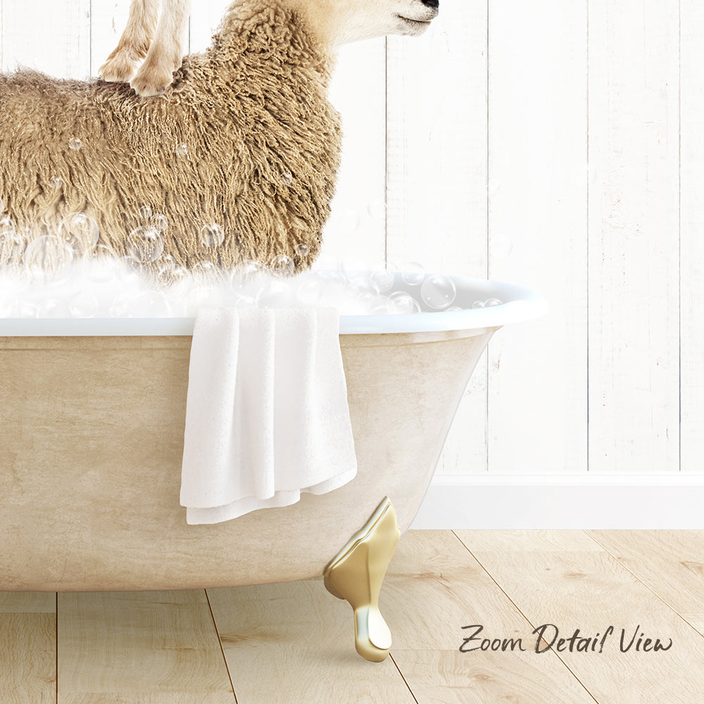 A fluffy brown sheep is sitting in a white bathtub filled with water, with a towel hanging on the side of the tub.